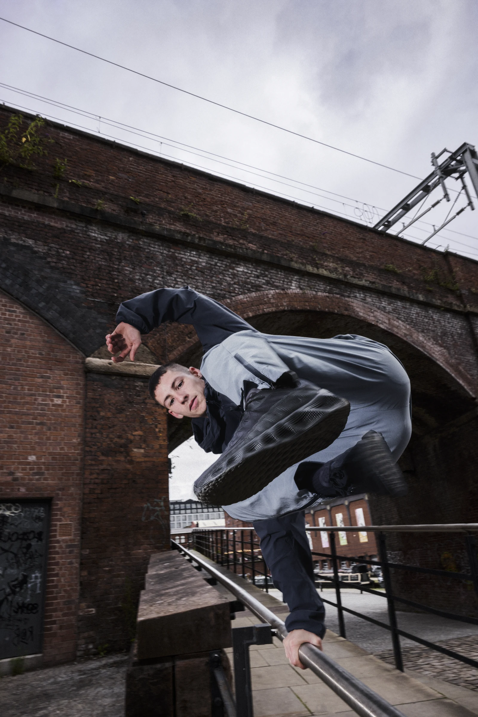 Footasylum campaign final: strike pose under the Castlefield viaduct arch