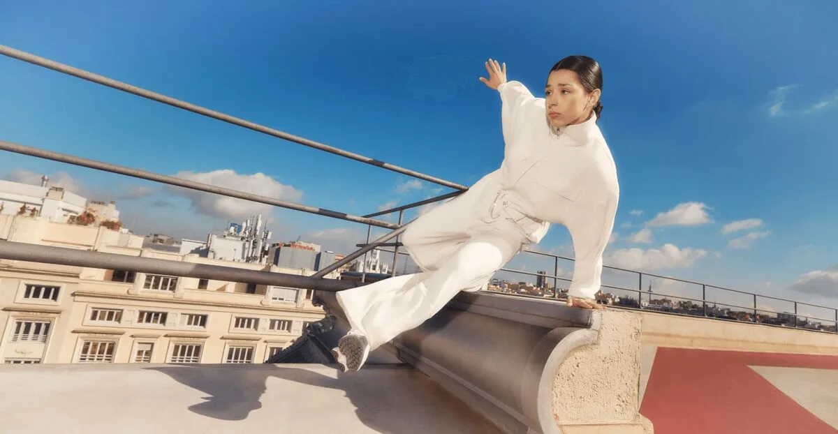 Parkour athlete assessing a rooftop line